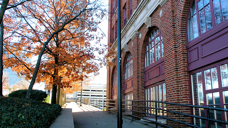brick building sidewalk in fall